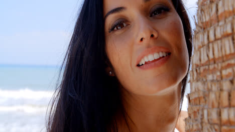 Close-up-Woman-at-the-Beach-Looking-at-the-Camera