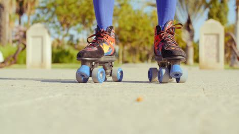 Low-Angle-Video-of-a-Girl-Riding-Roller-Skates