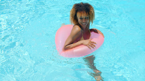 Young-Happy-Girl-Enjoying-Swimming-Pool