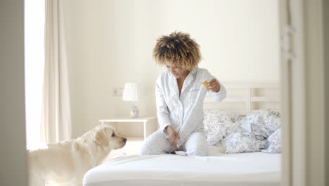 Woman-And-Her-Dog-Resting-In-Bed