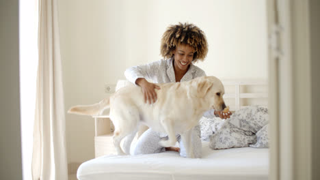 Woman-And-Her-Dog-In-The-Bed
