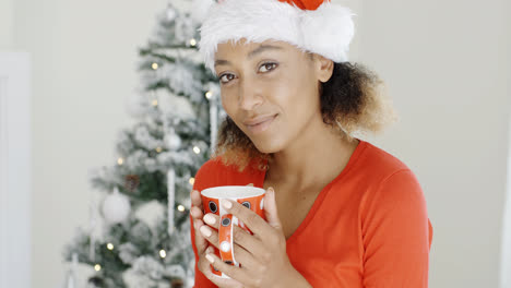 Young-girl-enjoying-coffee-on-Christmas-Day