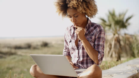 Girl-Working-With-A-Laptop-Outdoors