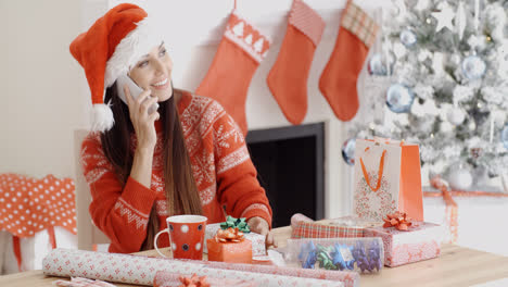 Young-woman-making-a-Christmas-greeting-call