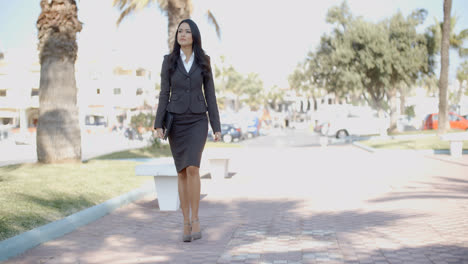 Lady-In-A-Suit-Walking-Down-The-Street