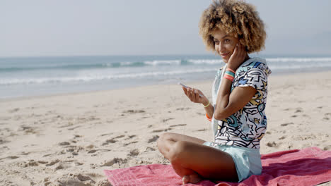 Woman-Listening-To-Music-On-The-Beach