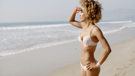 Woman-During-Sunbath-On-Tropical-Beach