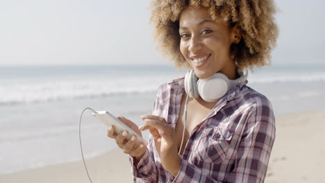 Girl-On-Beach-Listening-To-Music
