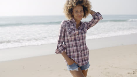Casual-Young-Woman-Standing-At-The-Beach
