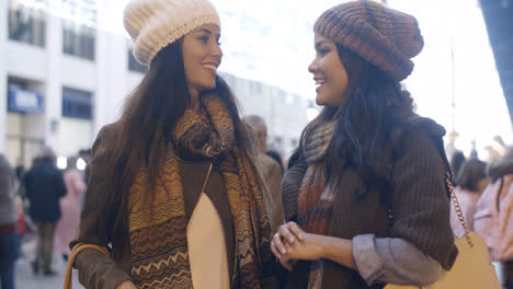 Two-women-chatting-in-a-street-in-winter