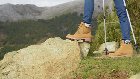 Person-in-hiking-boots-in-the-mountains