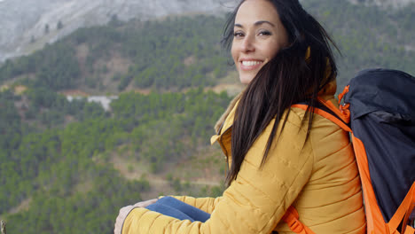 Happy-vivacious-young-woman-backpacker