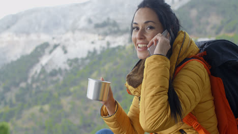 Hiker-talking-on-phone-during-a-break
