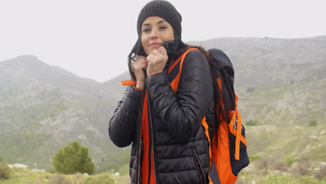 Young-active-woman-hiking-in-winter