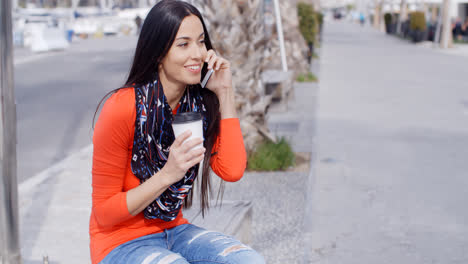 Trendy-chic-young-woman-listening-to-a-mobile-call