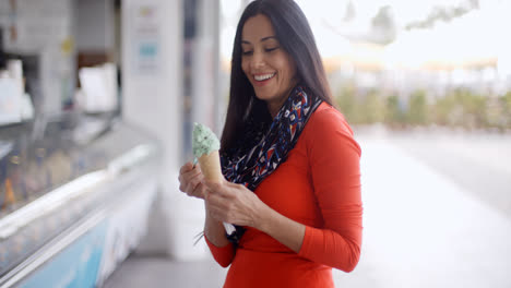 Attractive-young-woman-eating-an-ice-cream-cone