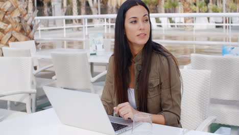 Young-businesswoman-working-outdoors-on-a-laptop