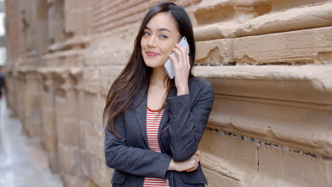 Young-woman-listening-to-a-call-on-her-mobile