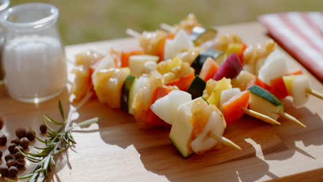 Four-chicken-and-vegetable-kabobs-on-cutting-board
