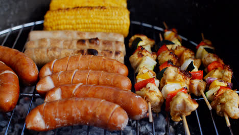 Sausages-and-vegetables-cooking-on-grill