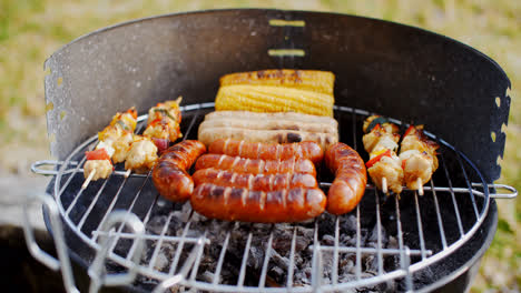 Sausages--corncobs-and-kebabs-grilling-on-a-BBQ