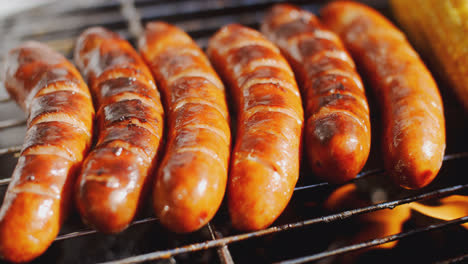 Tasty-juicy-sausages-grilling-over-a-fire