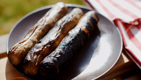 Three-charred-sausages-outside