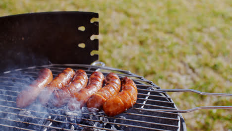 Thick-juicy-sausages-grilling-on-a-fire