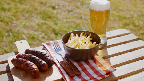 Three-tasty-smoked-grilled-sausages-with-chips