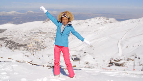 Single-woman-in-ski-clothes-waving-arms