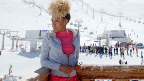 Trendy-young-woman-at-an-alpine-ski-resort