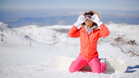 Young-woman-in-ski-clothes-in-the-snow