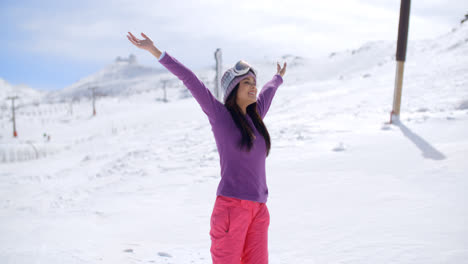 Happy-young-woman-celebrating-her-winter-vacation