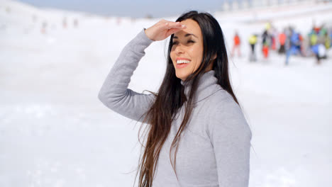 Gorgeous-smiling-young-woman-at-a-ski-resort