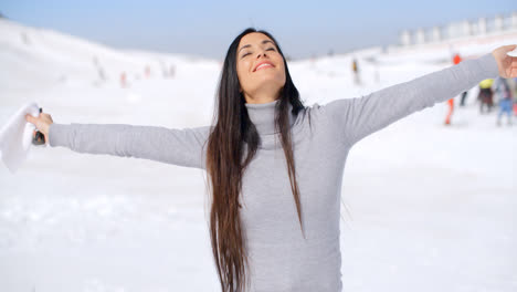 Young-woman-rejoicing-in-the-winter-weather