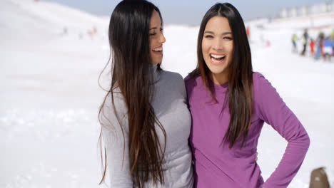 Laughing-vivacious-young-women-at-a-ski-resort