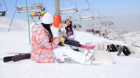 Two-attractive-female-snowboarders