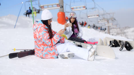 Two-attractive-female-snowboarders