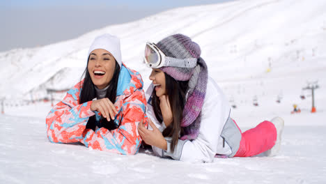 Laughing-skiers-laying-on-the-ground