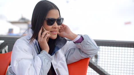 Young-woman-relaxing-at-an-alpine-ski-resort