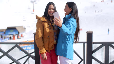 Two-young-women-laughing-at-their-selfie