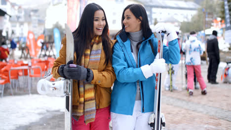 Happy-female-friends-at-a-winter-ski-resort