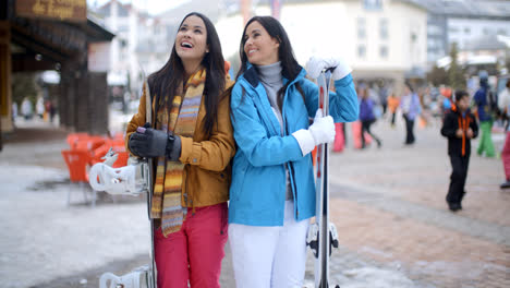 Two-gorgeous-young-brunette-snowboarders