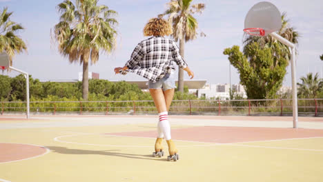 Rear-view-of-woman-on-roller-skates