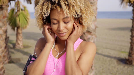 Sexy-young-African-woman-listening-to-music