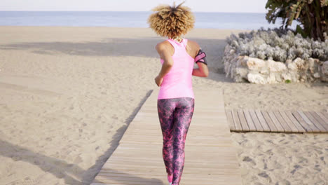 Healthy-fit-woman-jogging-away-from-the-camera