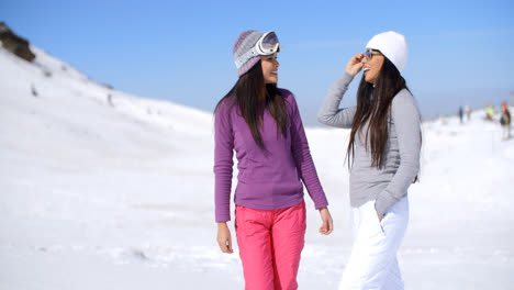 Two-attractive-women-friends-at-a-ski-resort