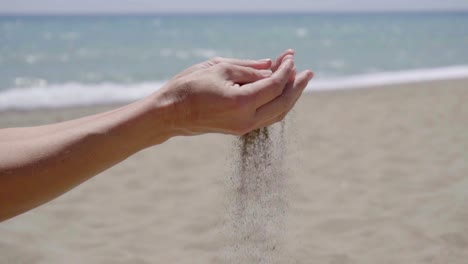 Stream-of-sand-pouring-from-hands
