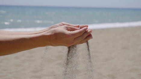 Stream-of-sand-pouring-from-hands