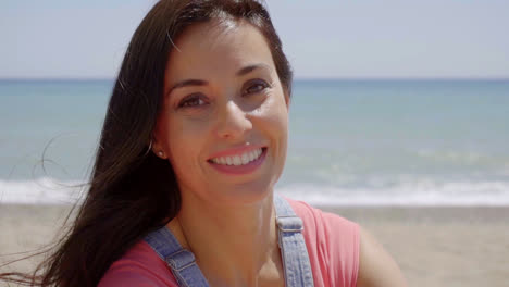 Close-up-of-happy-lady-with-ocean-background